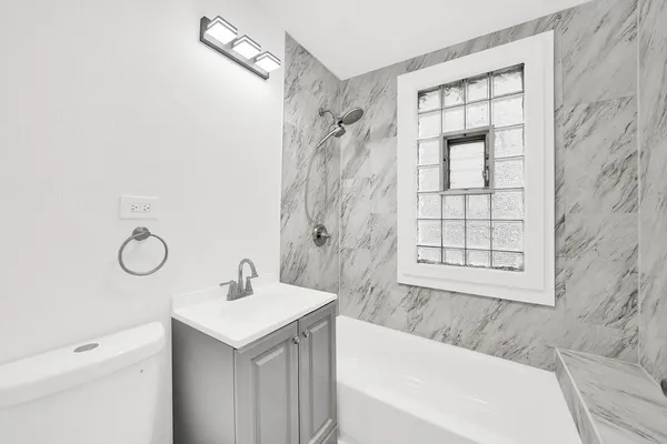 a bathroom with a sink a mirror and a shower