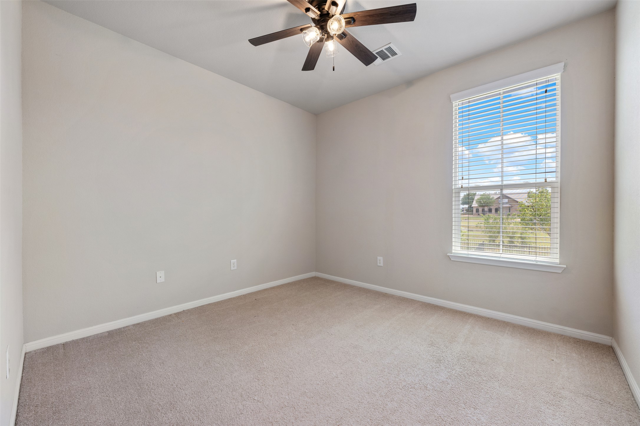 211 Parable Cove Pflugerville, TX 78660 - Photo 32 of 40 Bright room featuring carpet flooring and light-toned walls