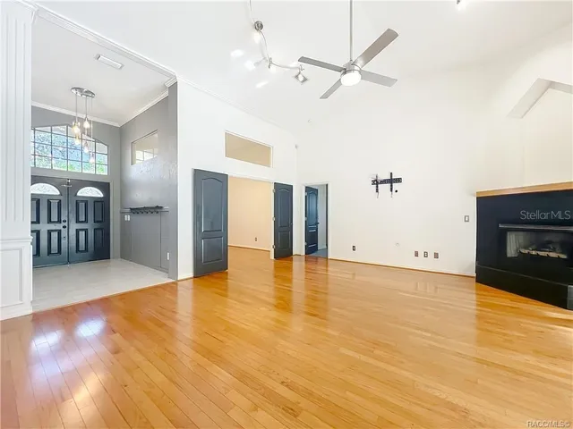 a view of an empty room with a fireplace