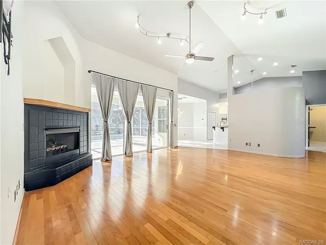 a kitchen with stainless steel appliances granite countertop a stove refrigerator sink and microwave