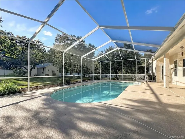 front view of a house with a swimming pool