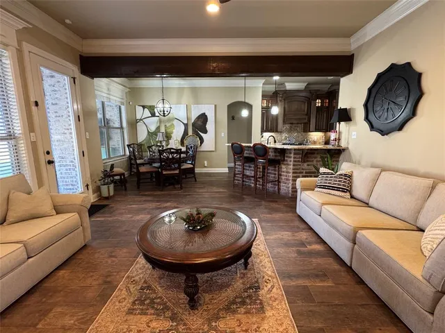 a living room with furniture and a clock