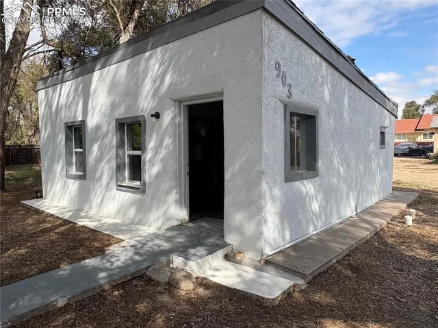 a view of a back yard of the house