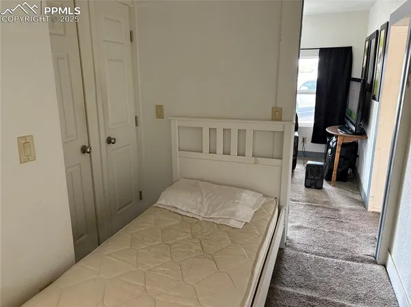 a large white bed in a white room