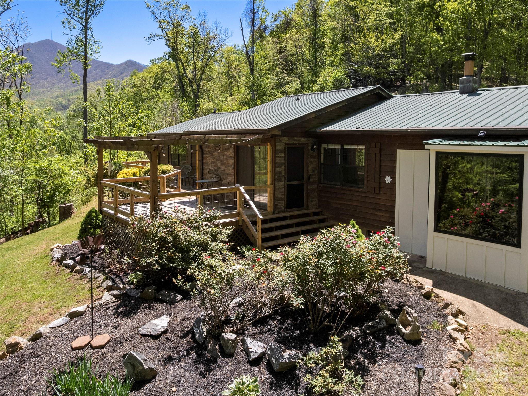 44 Sutton Knob Road Candler, NC 28715 - Photo 1 of 41 a backyard of a house with lots of green space