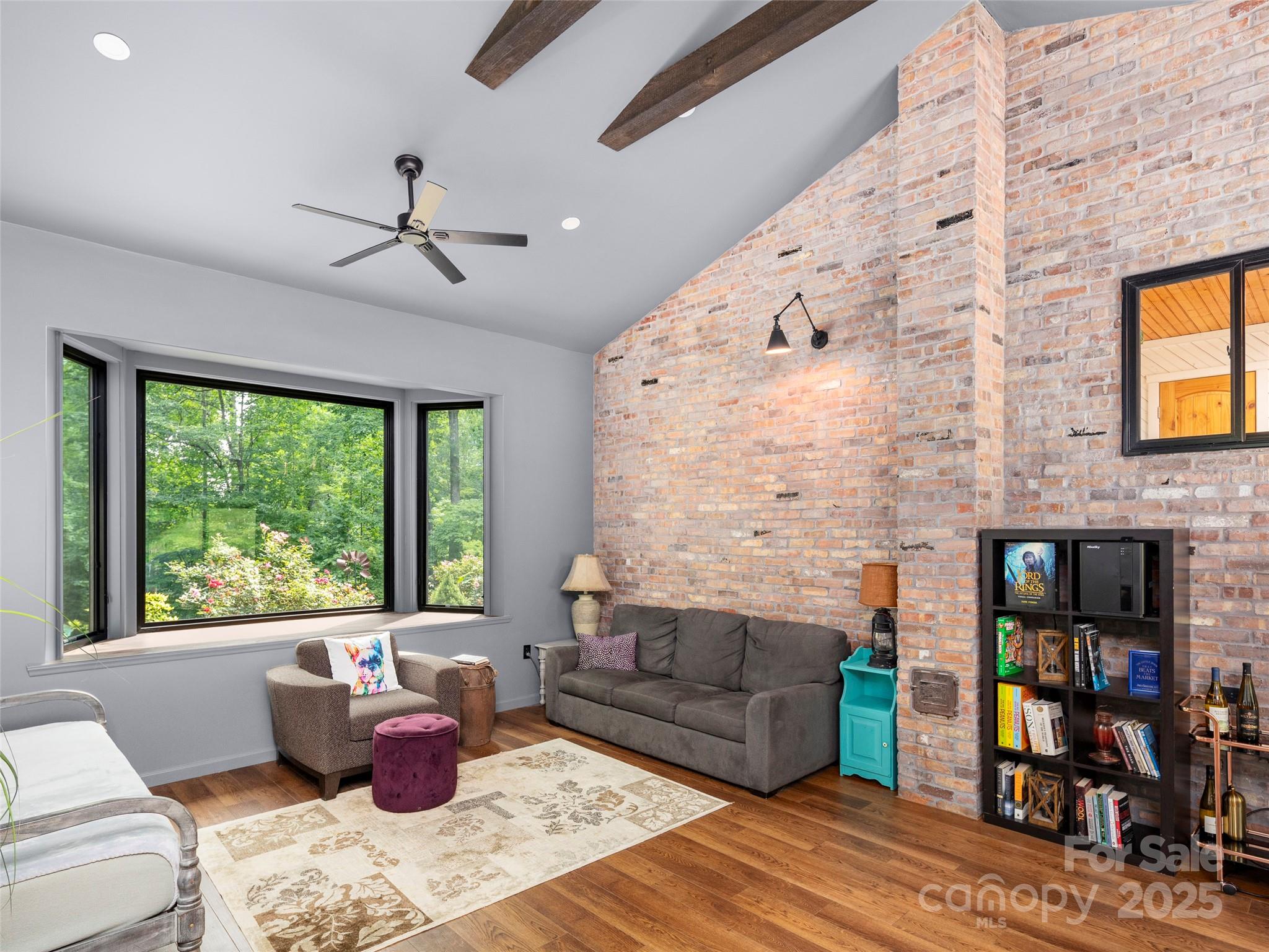 44 Sutton Knob Road Candler, NC 28715 - Photo 14 of 41 a living room with furniture and a fireplace