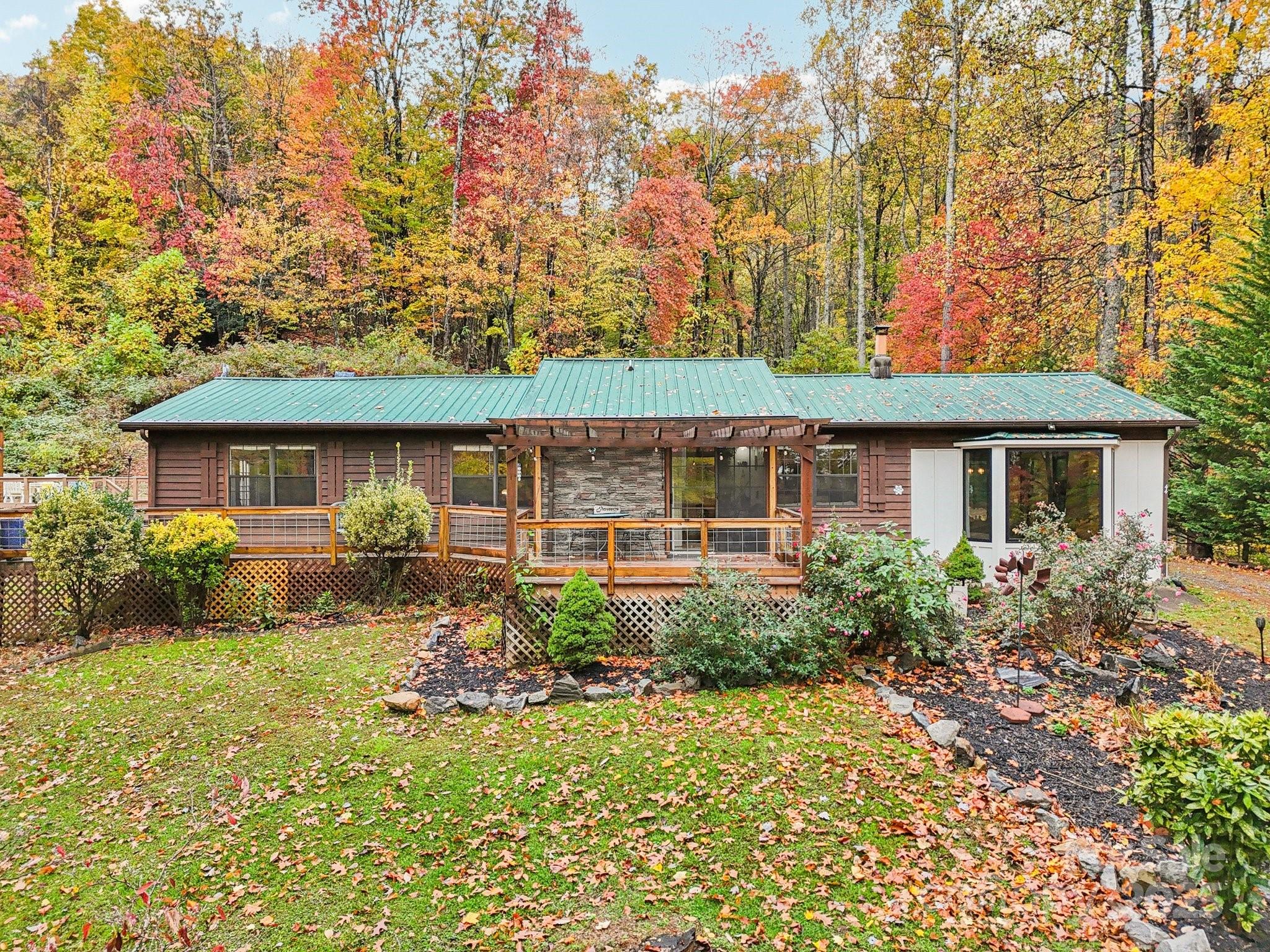 44 Sutton Knob Road Candler, NC 28715 - Photo 2 of 41 a front view of house with yard and green space