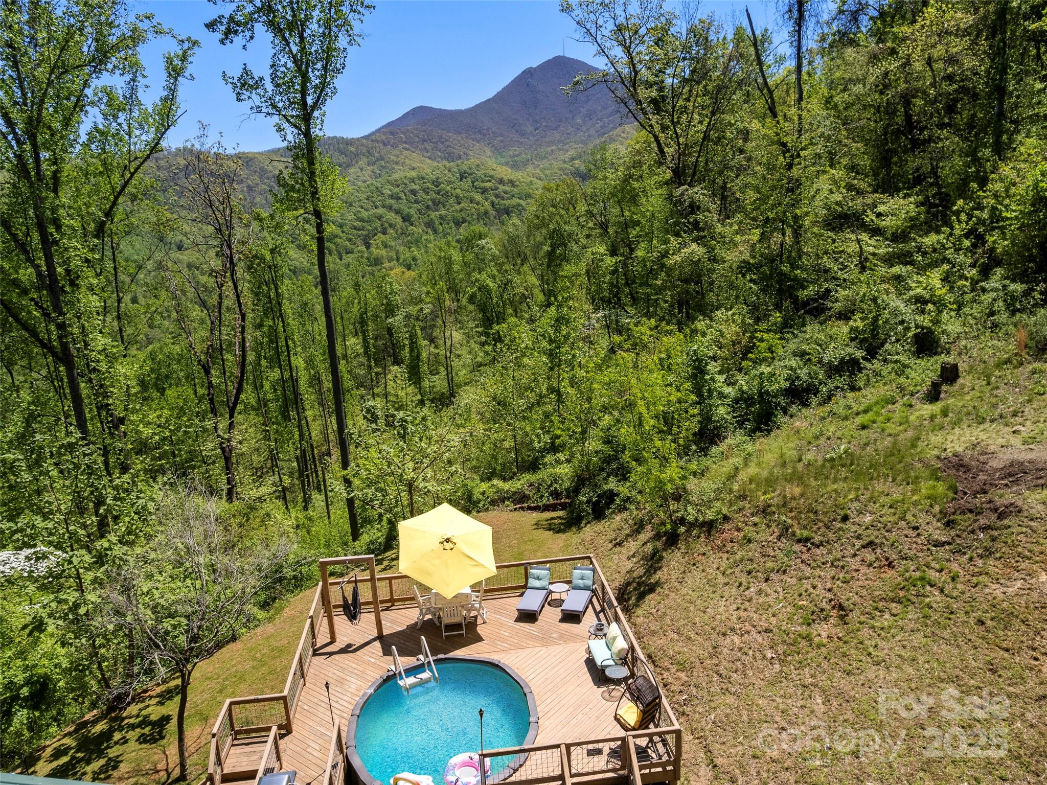 44 Sutton Knob Road Candler, NC 28715 - Photo 31 of 41 a backyard of a house with a yard