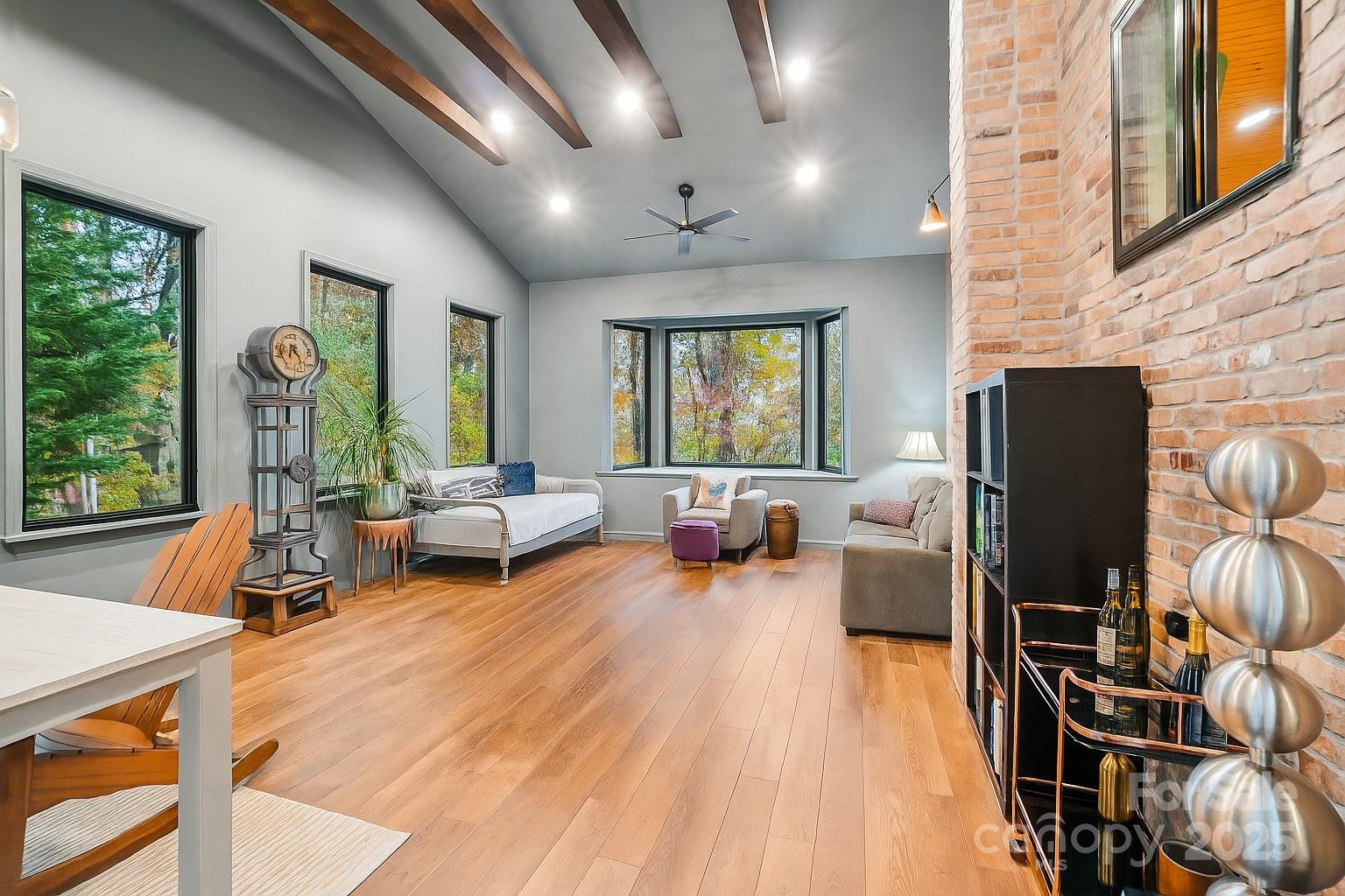 44 Sutton Knob Road Candler, NC 28715 - Photo 4 of 41 a living room with furniture and a flat screen tv