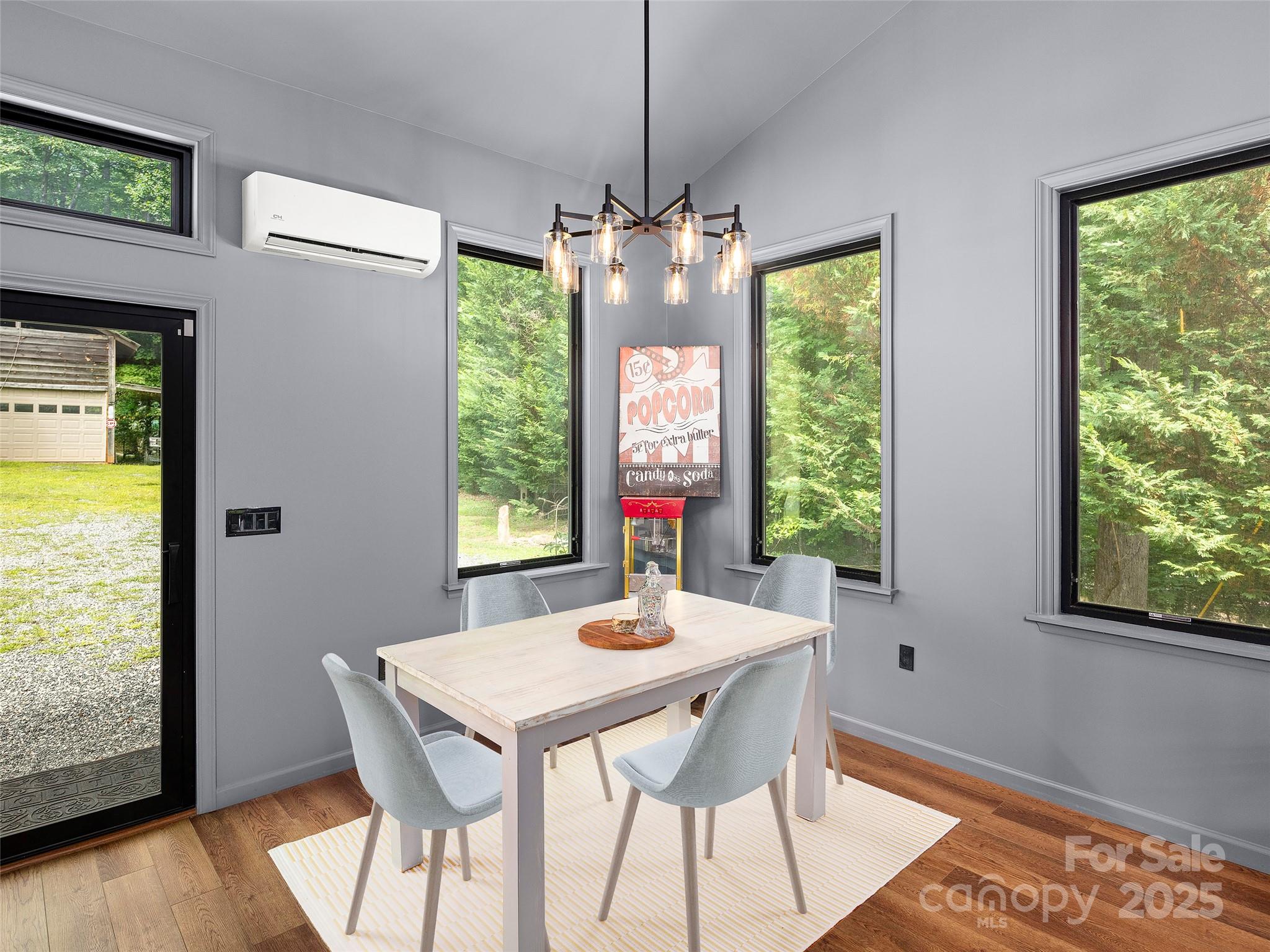 44 Sutton Knob Road Candler, NC 28715 - Photo 5 of 41 a view of a dining room with furniture window and outside view