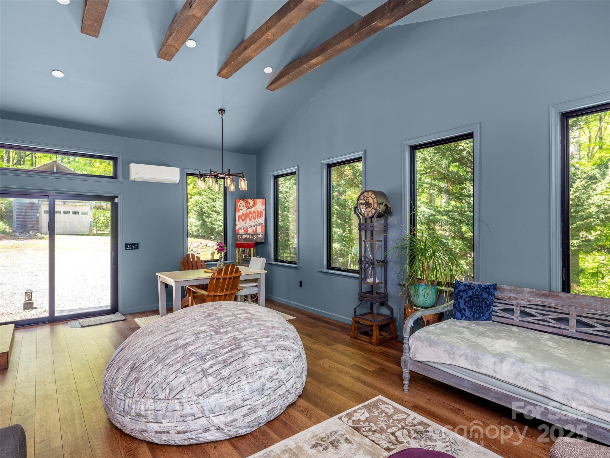 44 Sutton Knob Road Candler, NC 28715 - Photo 9 of 41 a bedroom with large window and a table