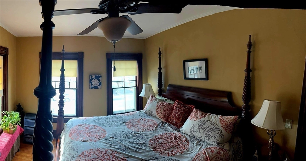 58 Oak Street Boston, MA 02136 - Photo 18 of 26 a bedroom with a bed wooden floor and lamp