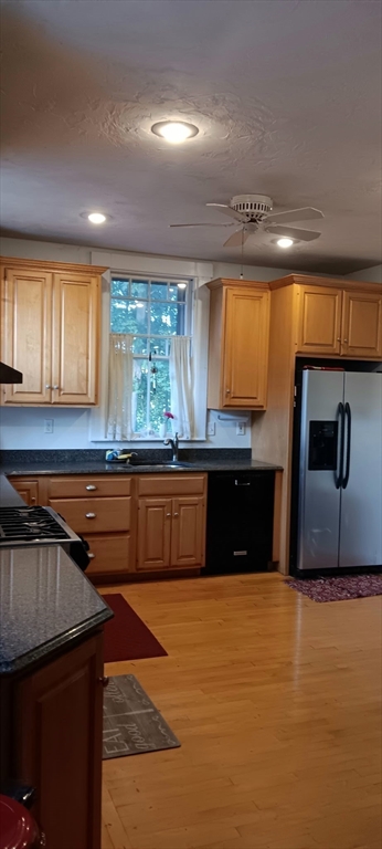 58 Oak Street Boston, MA 02136 - Photo 2 of 26 a kitchen with stainless steel appliances granite countertop a sink and a counter space