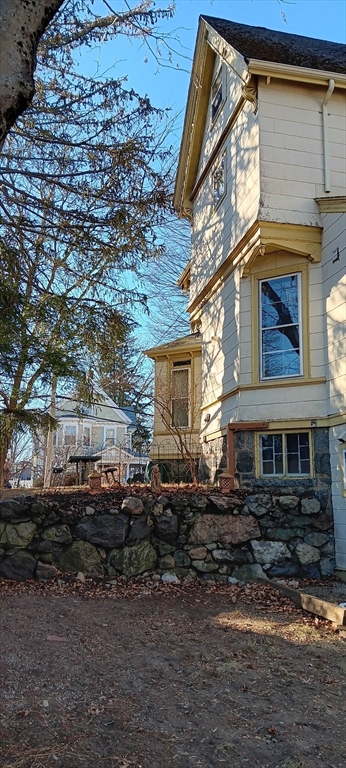 58 Oak Street Boston, MA 02136 - Photo 26 of 26 a front view of a house with a yard