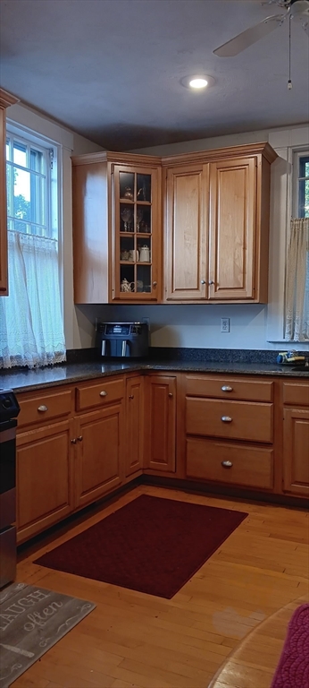 58 Oak Street Boston, MA 02136 - Photo 3 of 26 a kitchen with granite countertop cabinets and window