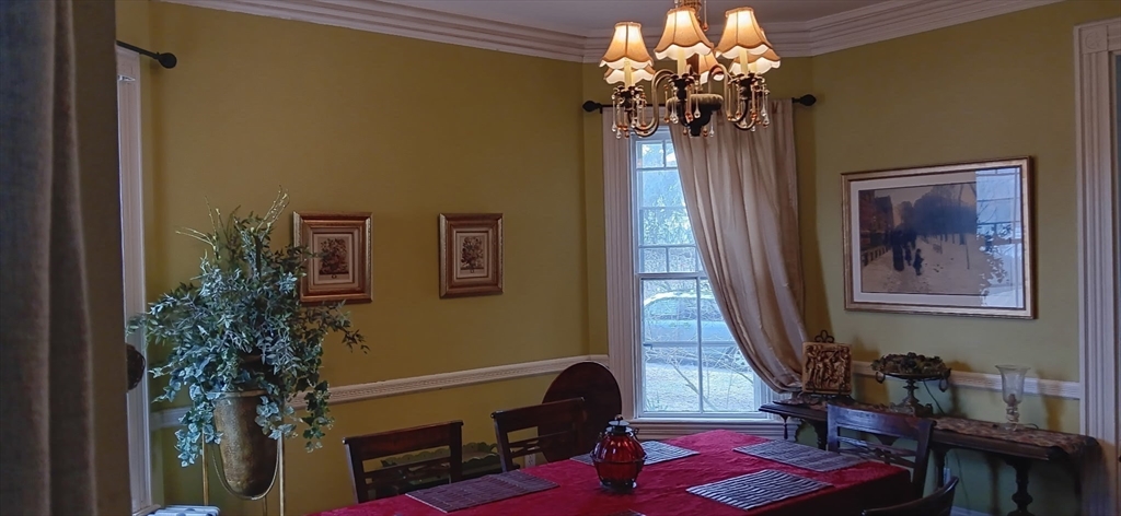 58 Oak Street Boston, MA 02136 - Photo 8 of 26 a view of a room with furniture and chandelier
