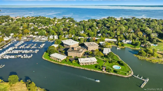 a view of a lake with lawn chairs