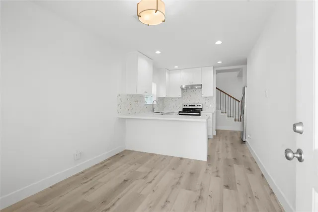 a view of kitchen with wooden floor