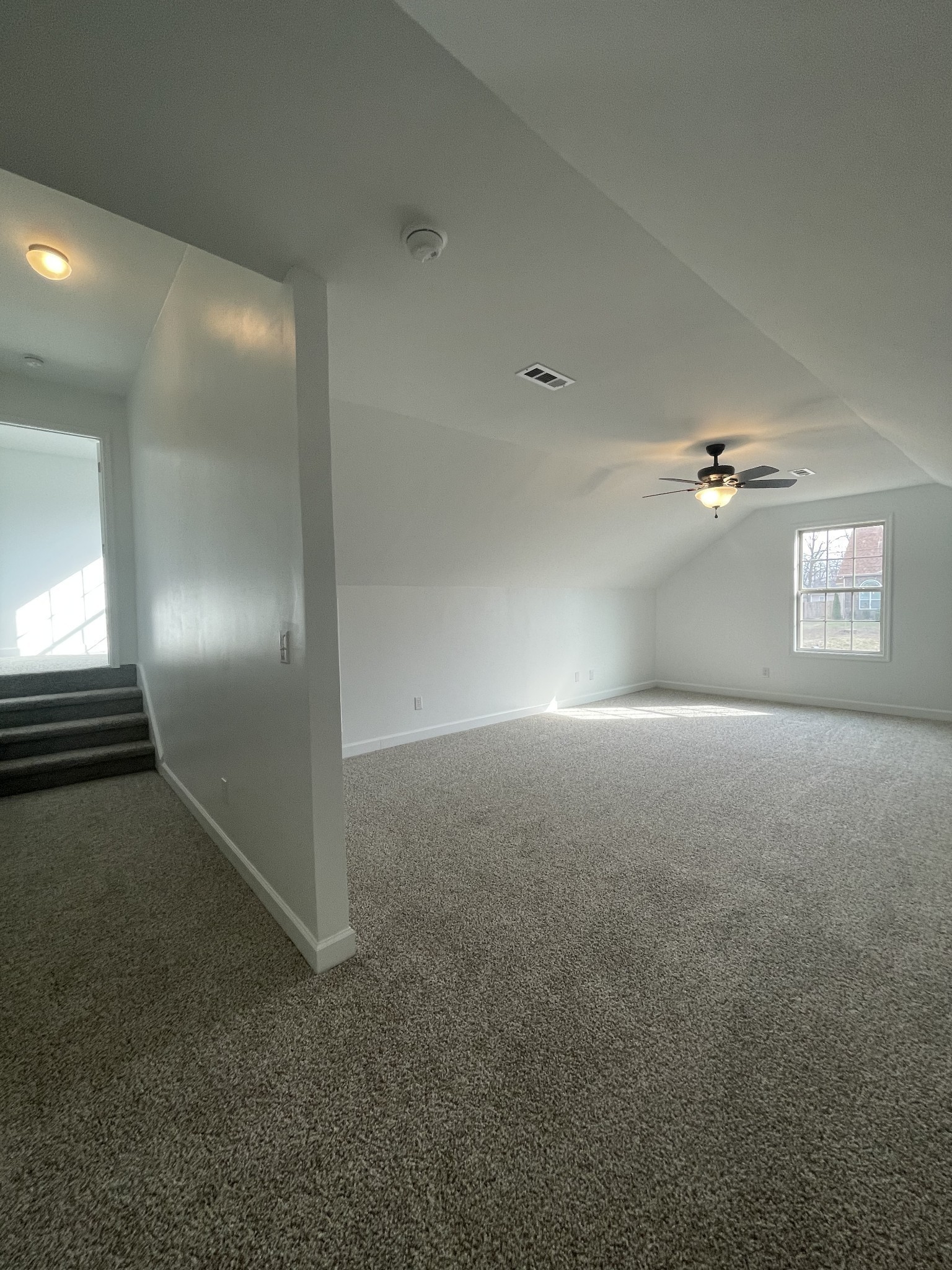 1501 Trainer Road Clarksville, TN 37042 - Photo 16 of 19 an empty room with windows and ceiling fan