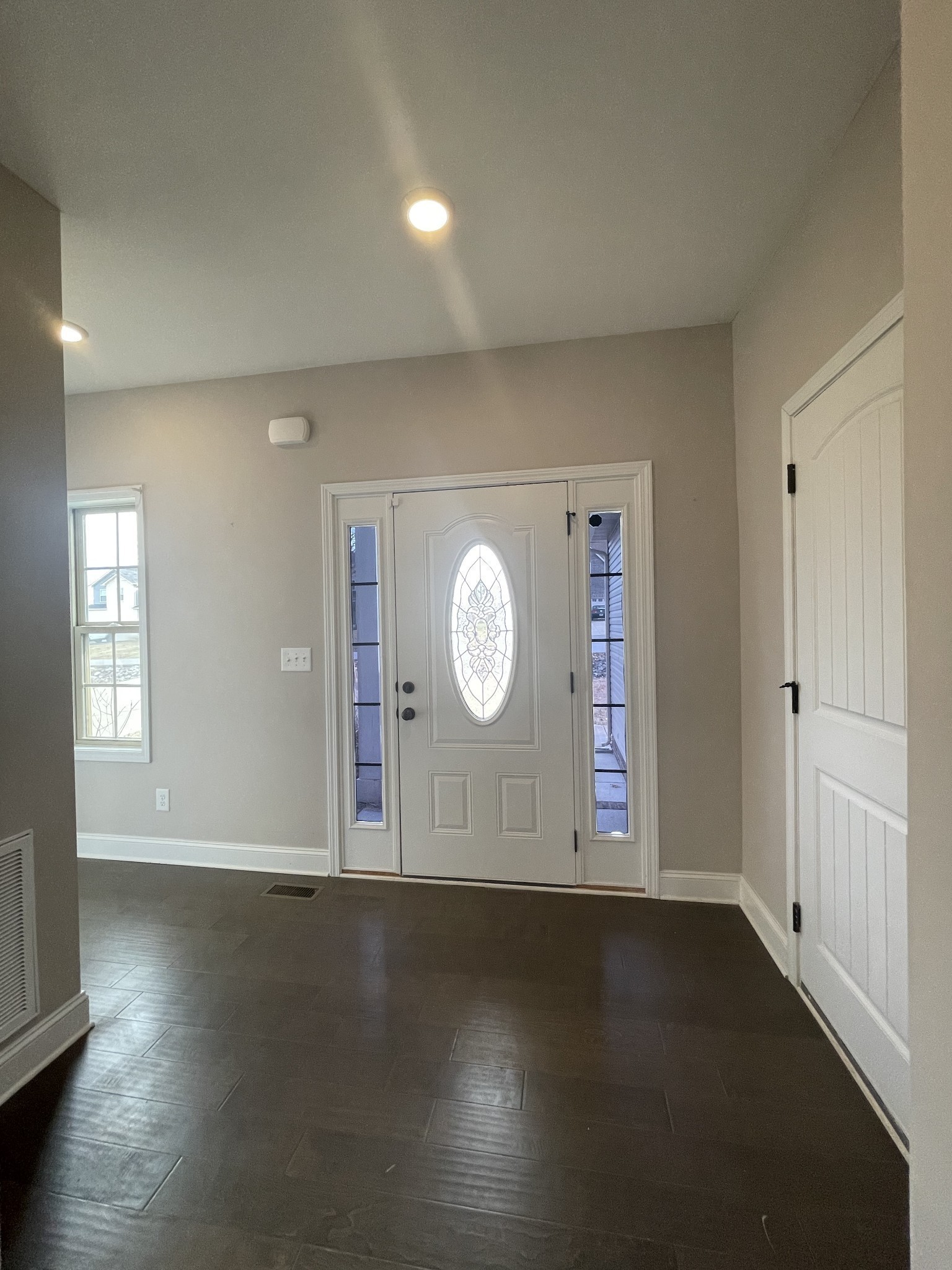 1501 Trainer Road Clarksville, TN 37042 - Photo 3 of 19 an empty room with wooden floor and windows