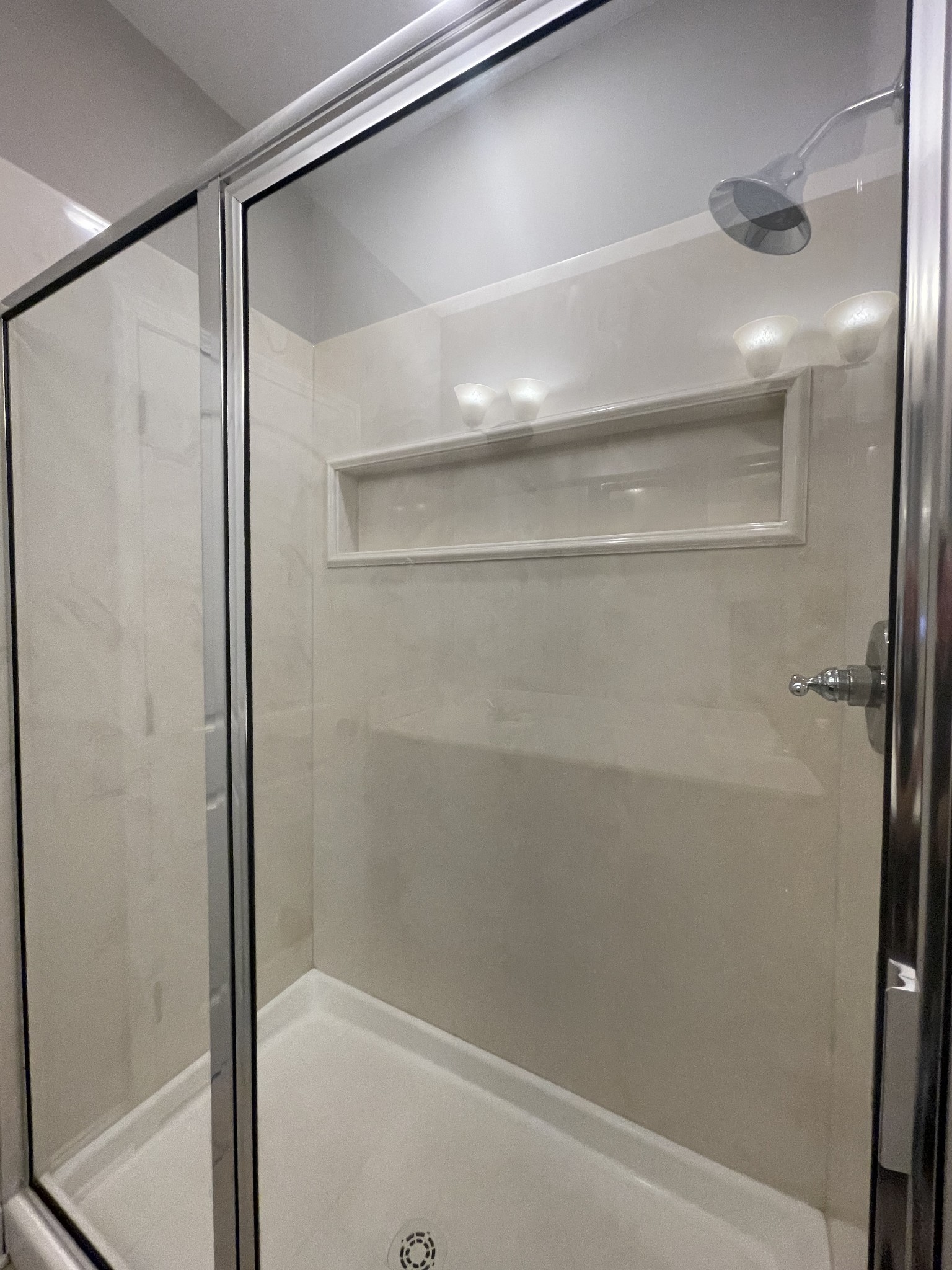 1501 Trainer Road Clarksville, TN 37042 - Photo 10 of 19 a bathroom with a glass shower door