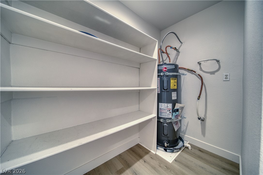 851 Lone Pine Road Pahrump, NV 89048 - Photo 12 of 25 Functional utility space with built-in shelving and essential water heating equipment.