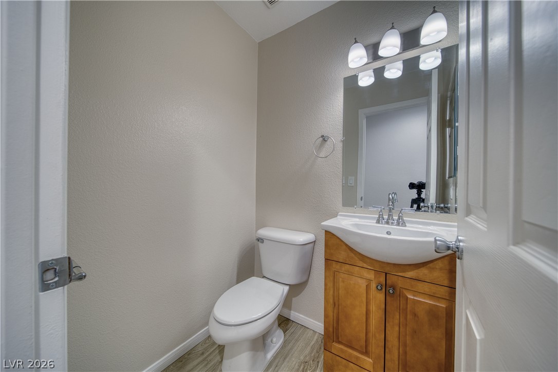 851 Lone Pine Road Pahrump, NV 89048 - Photo 13 of 25 This clean and functional powder room features a classic vanity and contemporary fixtures.