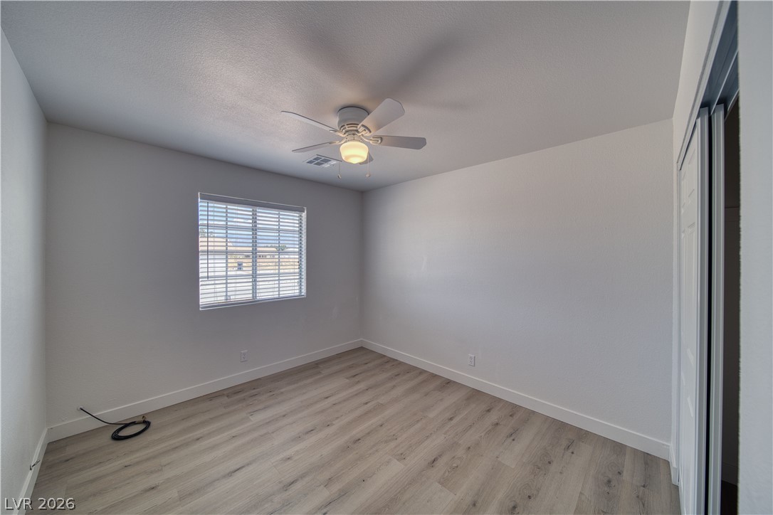 851 Lone Pine Road Pahrump, NV 89048 - Photo 17 of 25 Bright and airy room with durable flooring and natural light.