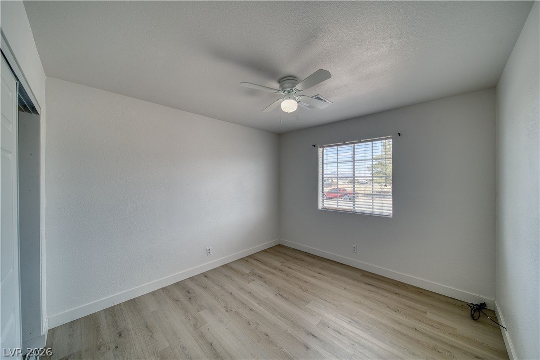 851 Lone Pine Road Pahrump, NV 89048 - Photo 19 of 25 This airy bedroom features abundant natural light, creating a serene and inviting atmosphere.