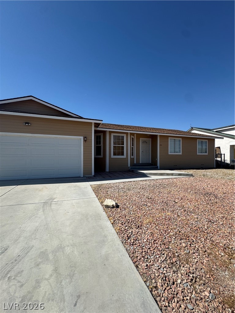 851 Lone Pine Road Pahrump, NV 89048 - Photo 2 of 25 This charming residence features a well-maintained exterior and a practical driveway.
