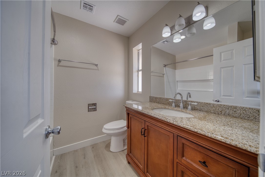851 Lone Pine Road Pahrump, NV 89048 - Photo 25 of 25 This bathroom features a contemporary vanity and ample natural light, creating a bright and inviting atmosphere.