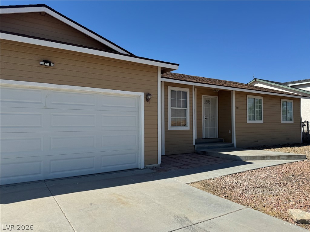 851 Lone Pine Road Pahrump, NV 89048 - Photo 4 of 25 This inviting residence features a well-maintained exterior and an attached garage.