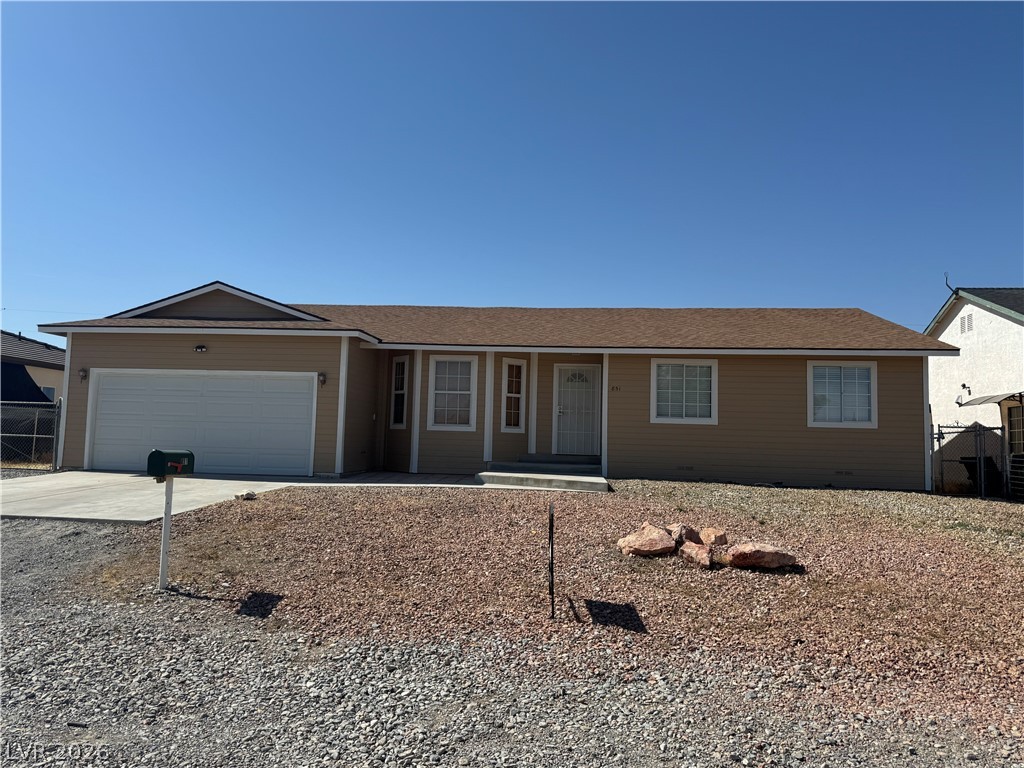 851 Lone Pine Road Pahrump, NV 89048 - Photo 5 of 25 This cozy home offers convenient living with a classic facade and an attached garage.