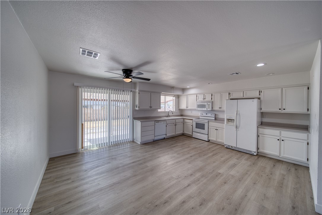 851 Lone Pine Road Pahrump, NV 89048 - Photo 9 of 25 This bright kitchen and dining area offers functional design with easy outdoor access.