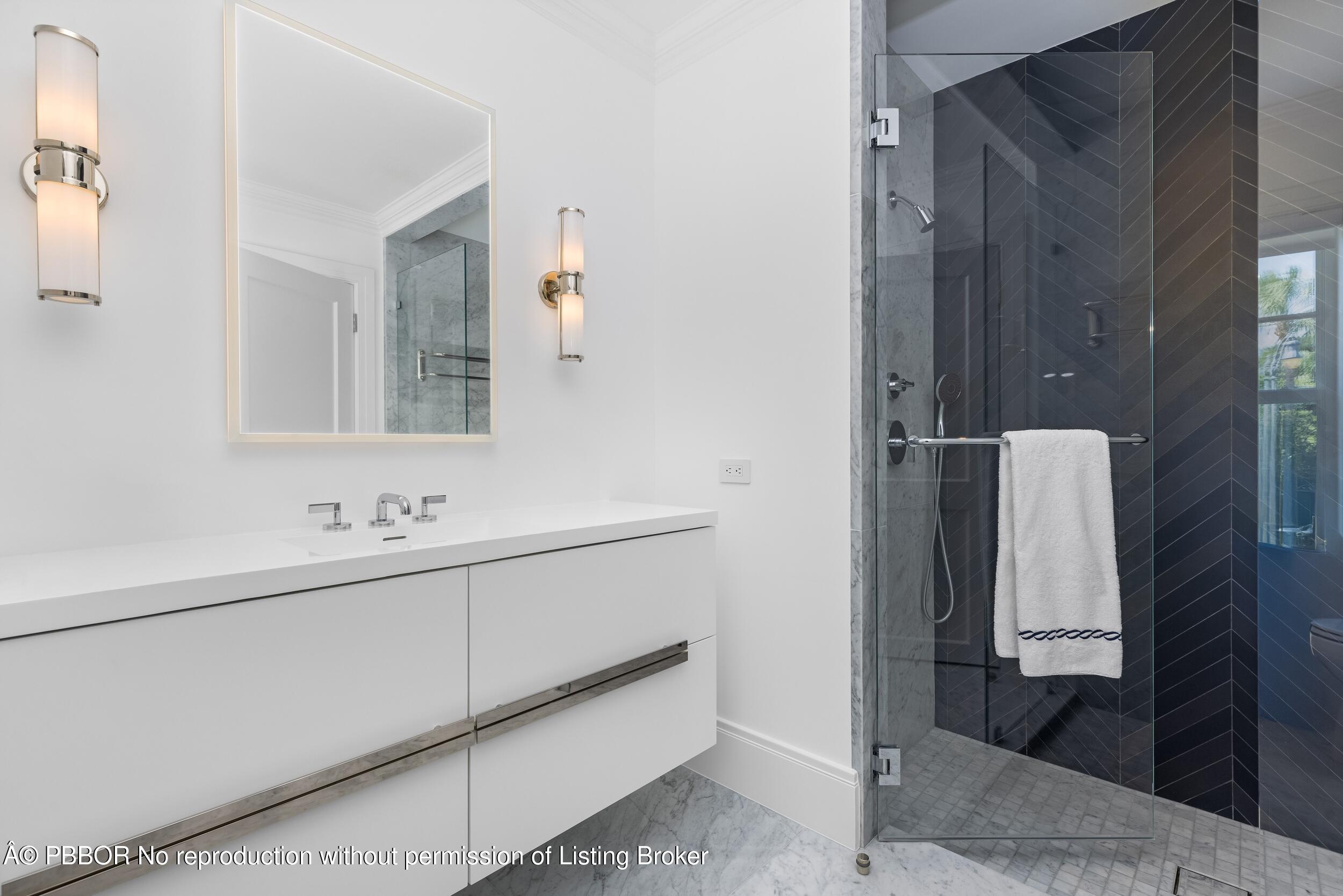 201 Banyan Road Palm Beach, FL 33480 - Photo 22 of 42 a bathroom with a sink and mirror