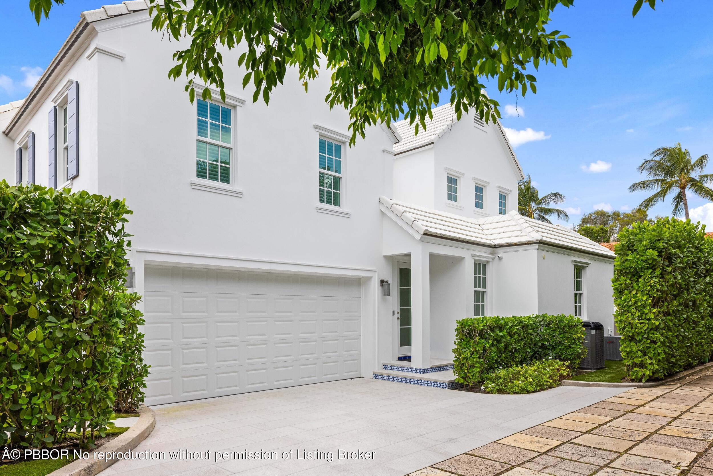 201 Banyan Road Palm Beach, FL 33480 - Photo 42 of 42 a front view of a house with a garden