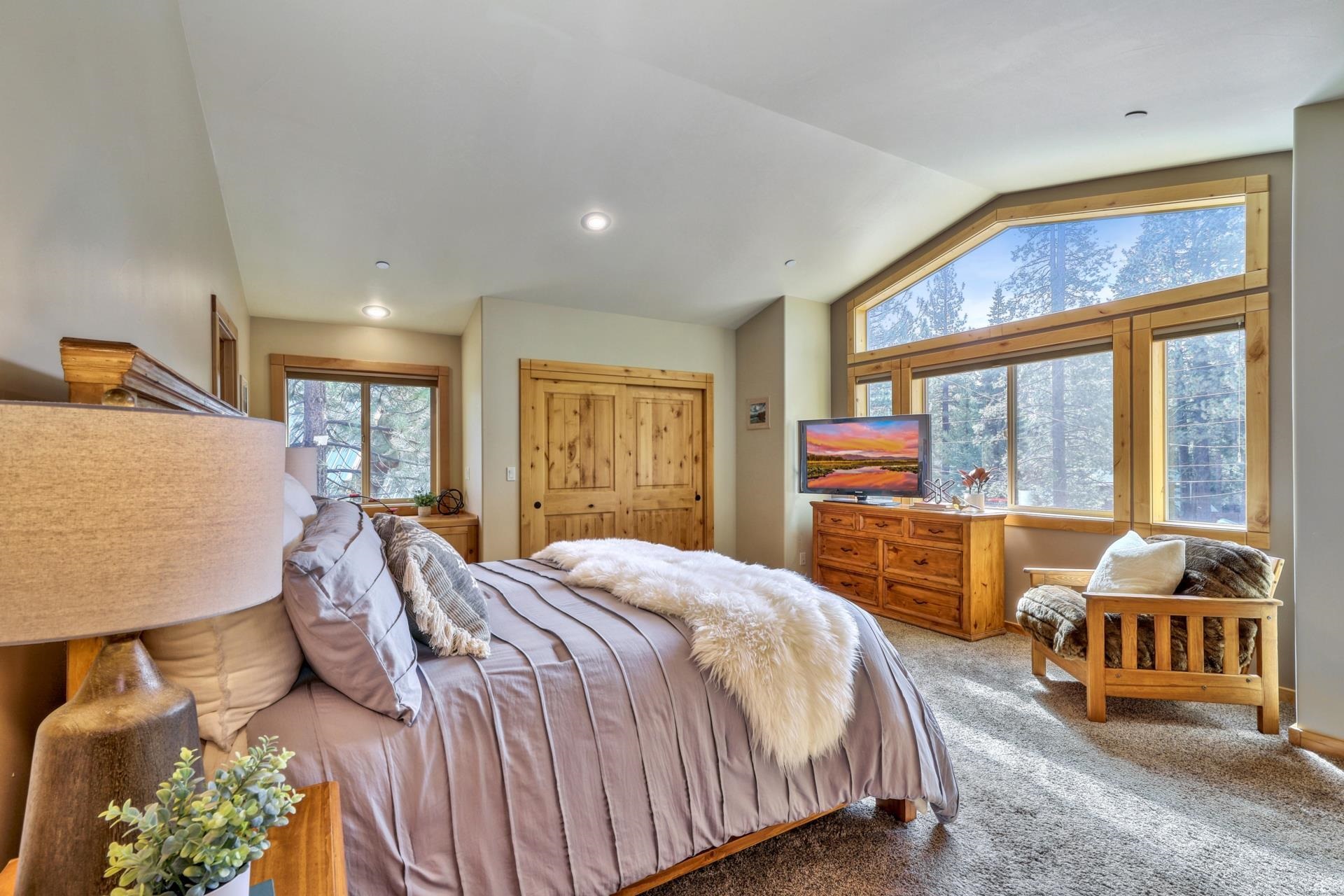 14152 Ski View Loop Truckee, CA 96161 - Photo 13 of 28 a bedroom with a bed and large windows