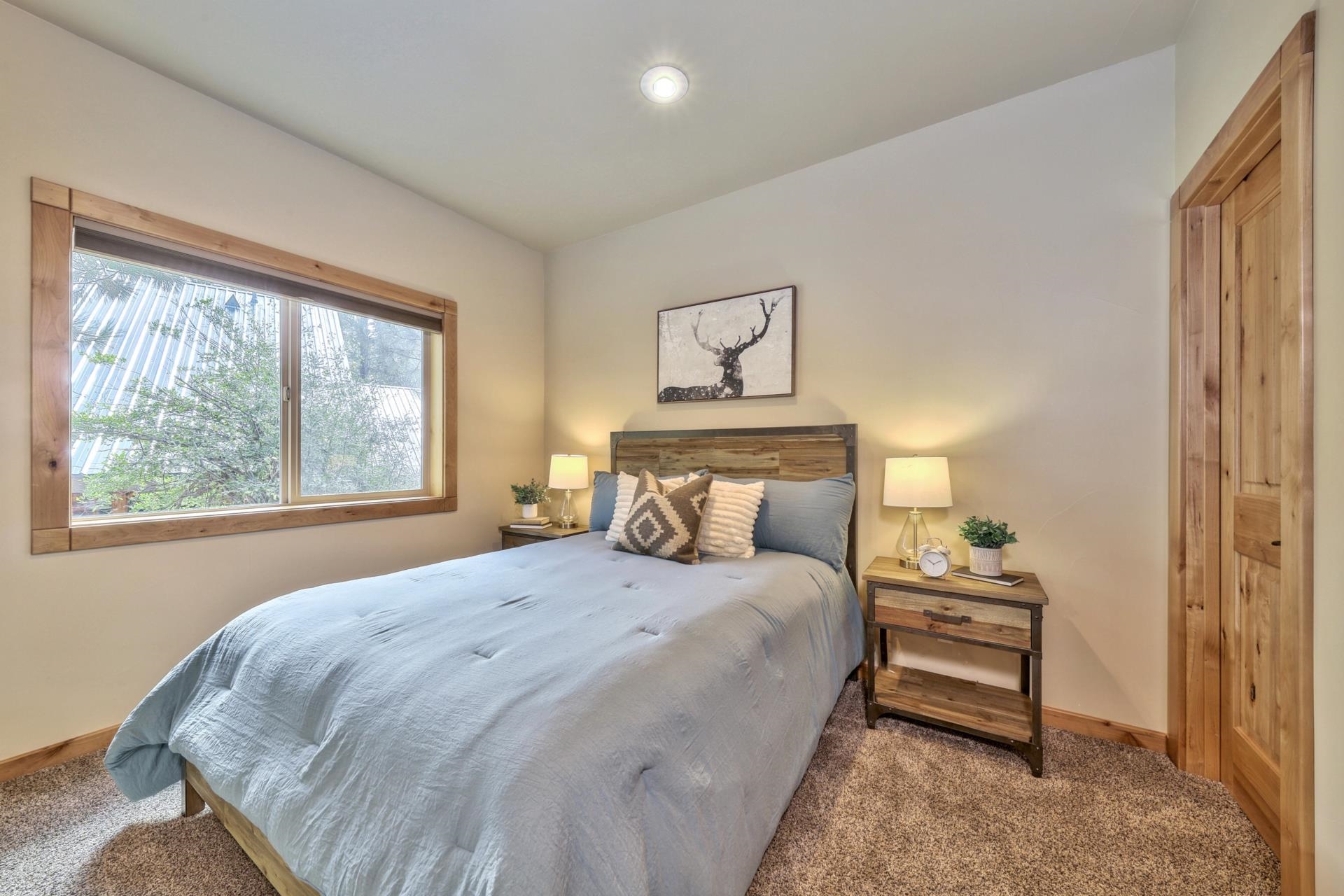 14152 Ski View Loop Truckee, CA 96161 - Photo 22 of 28 a bedroom with a bed and a painting on the wall