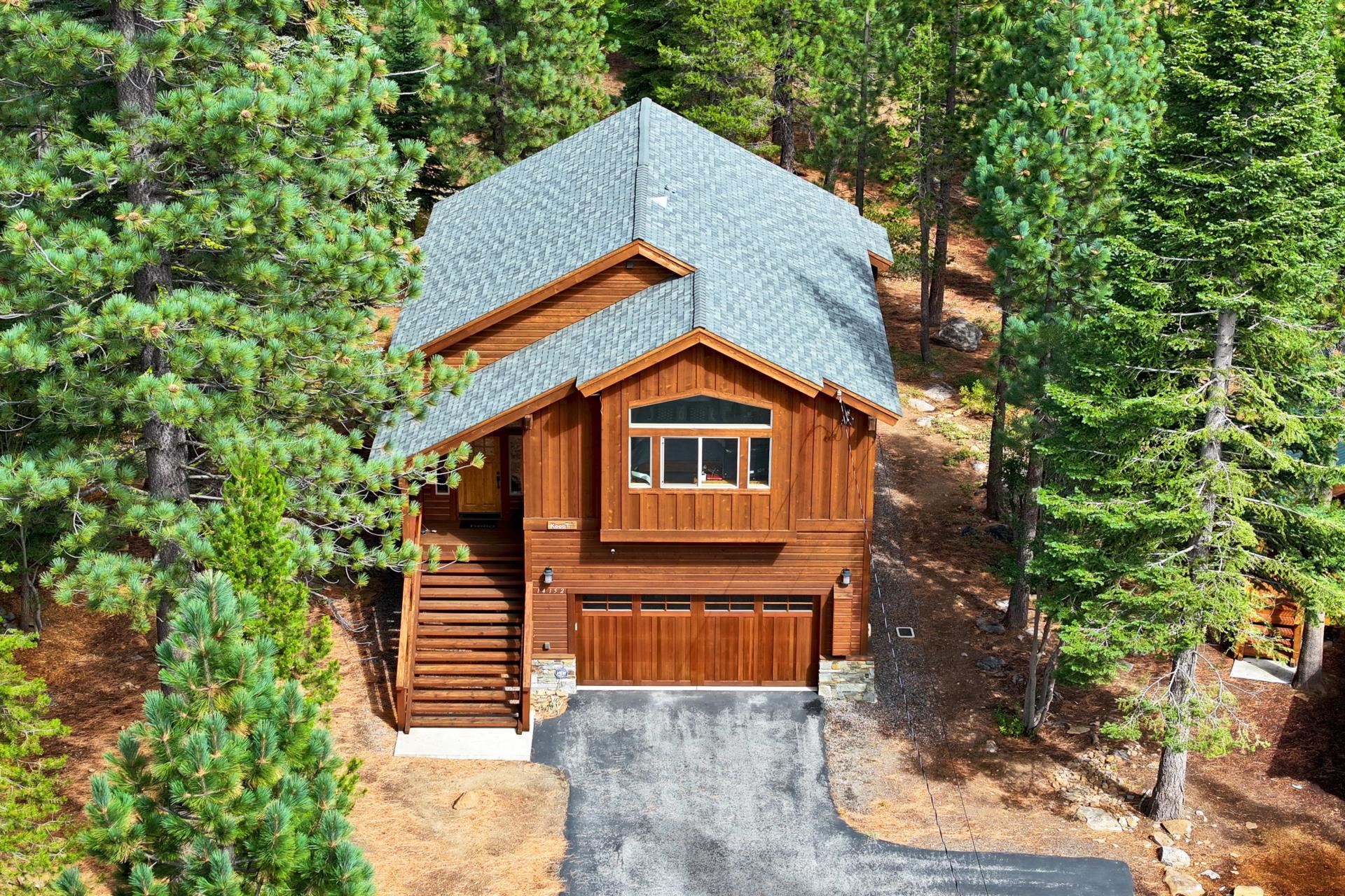 14152 Ski View Loop Truckee, CA 96161 - Photo 5 of 28 a front view of house with yard and trees in the background
