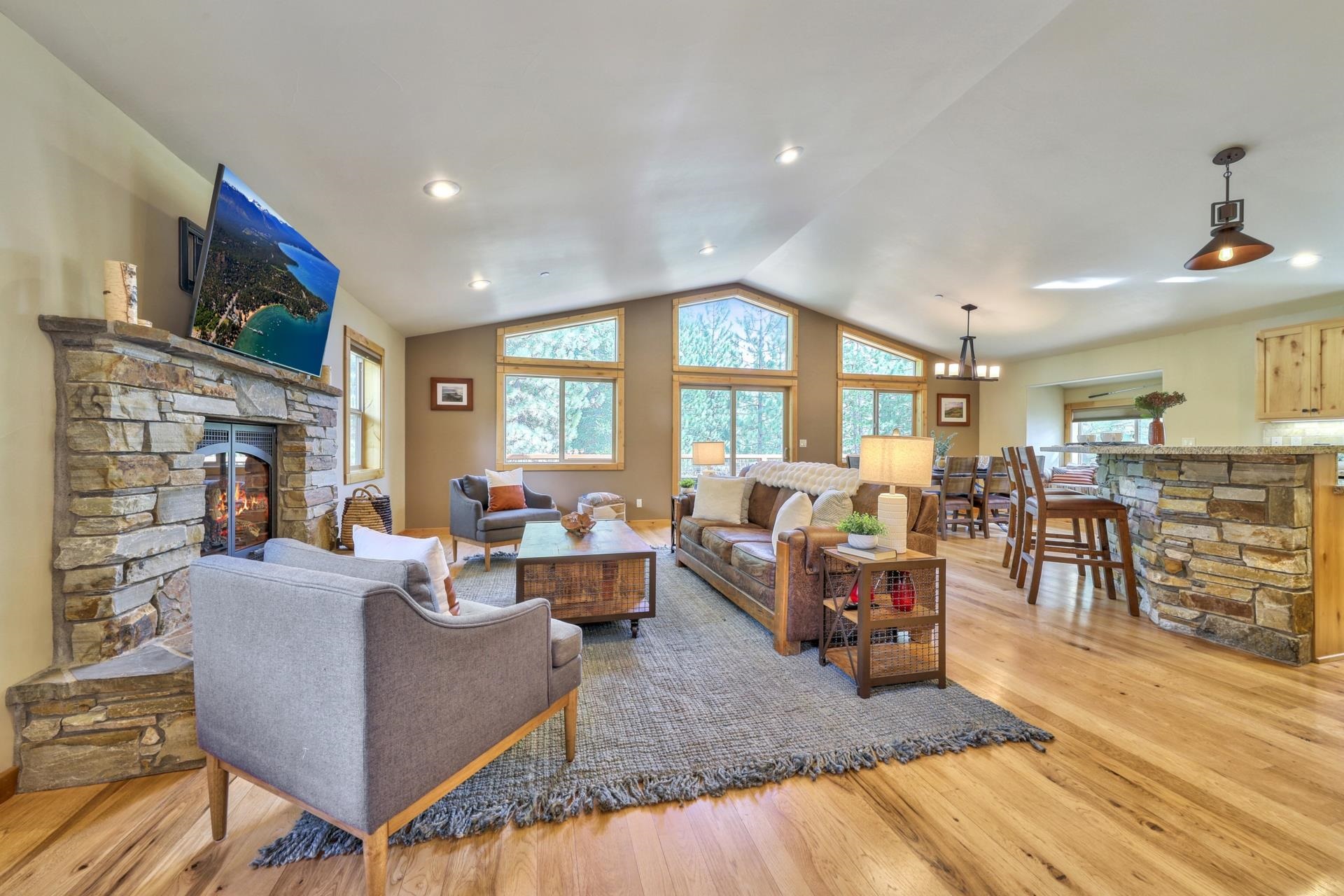 14152 Ski View Loop Truckee, CA 96161 - Photo 7 of 28 a living room with fireplace furniture and a wooden floor