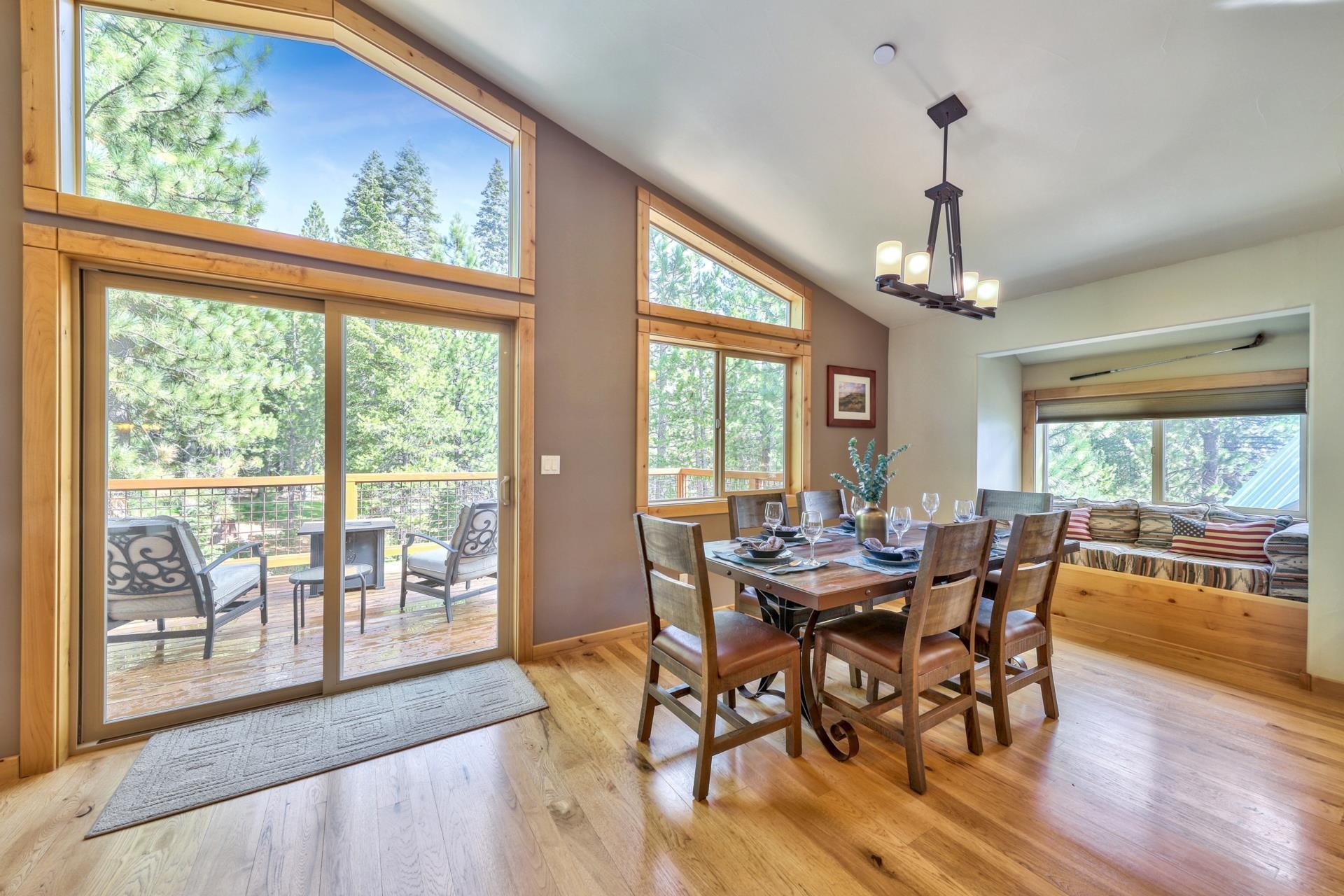 14152 Ski View Loop Truckee, CA 96161 - Photo 10 of 28 a view of a dining room with furniture wooden floor and a chandelier