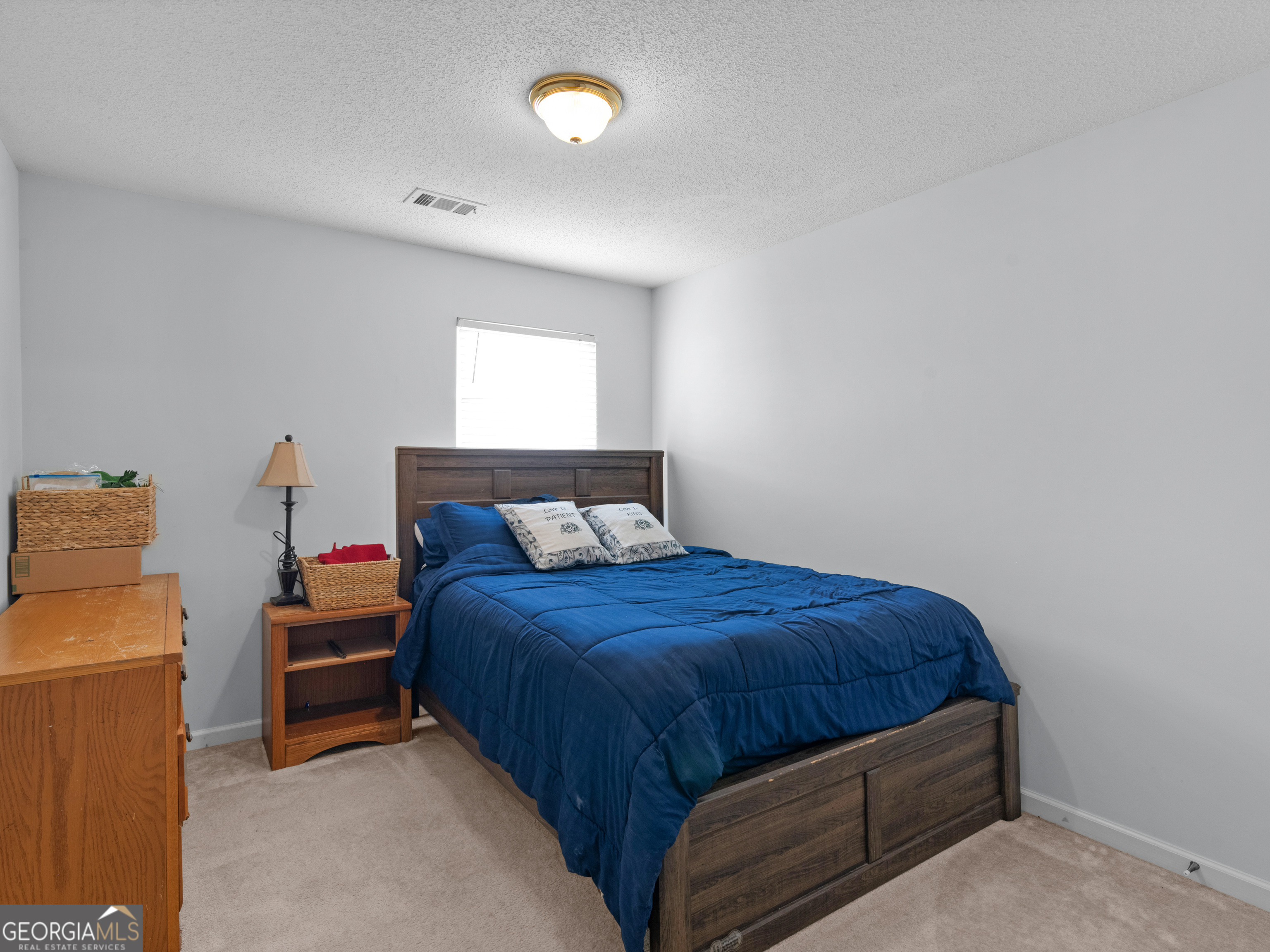 3370 Waggoner Place Rex, GA 30273 - Photo 20 of 25 a bedroom with a bed and a window