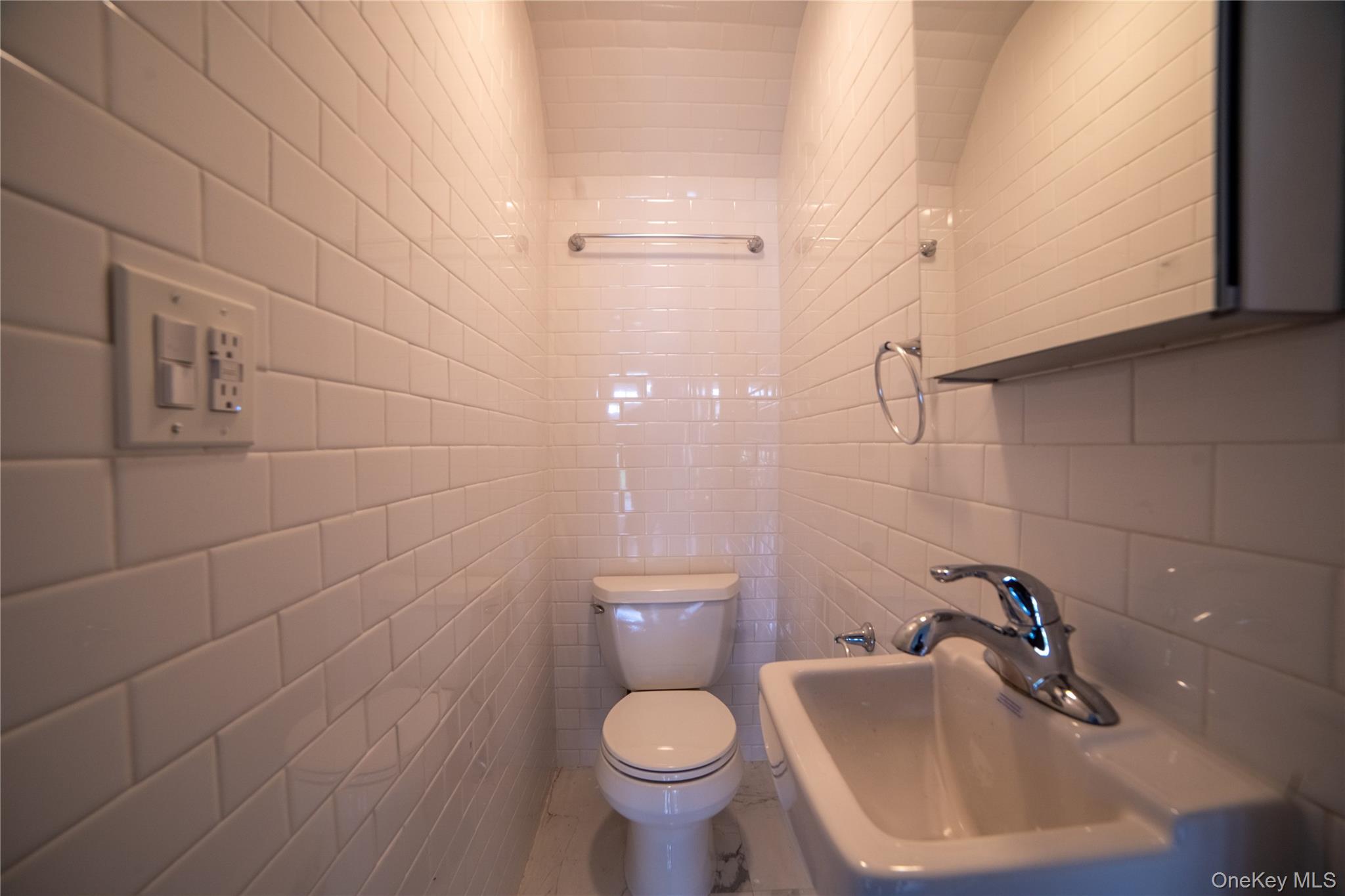 154 Bell Road Scarsdale, NY 10583 - Photo 17 of 35 Half guest bathroom on the main entrance floor.