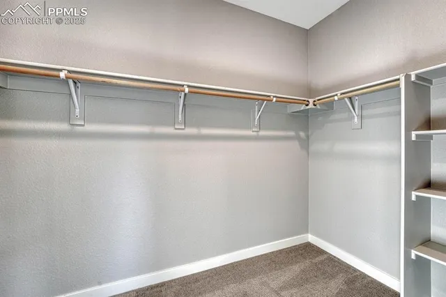 a view of an empty walk in closet