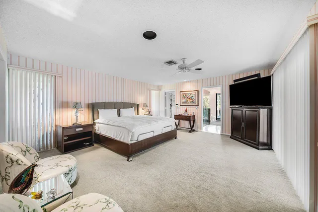a large bathroom with a large tub and shower