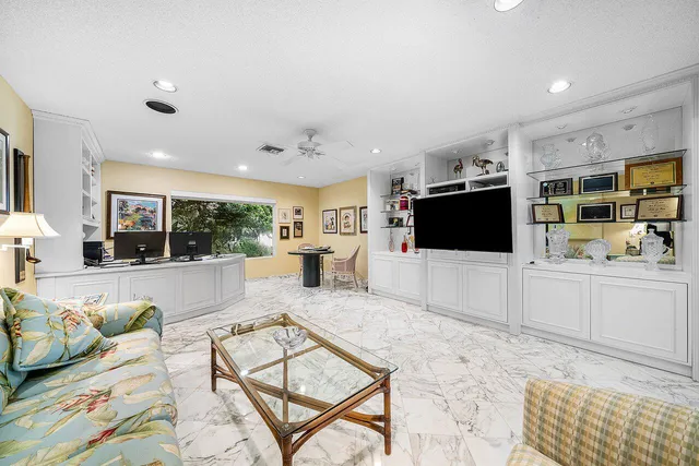 a kitchen with stainless steel appliances granite countertop a sink and a refrigerator