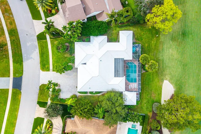 a view of house with backyard