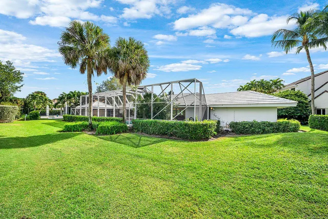 an aerial view of residential houses with outdoor space and street view