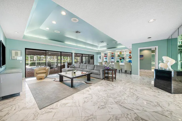 a living room with furniture and flat screen tv