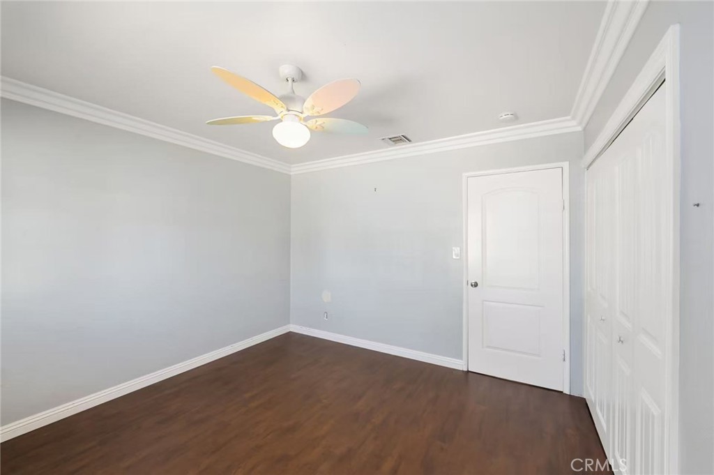 10566 Calabash Avenue Fontana, CA 92337 - Photo 6 of 20 an empty room with a window and ceiling fan